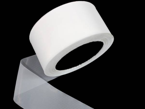 A roll of nylon filter mesh filter belt/ribbon on black background.