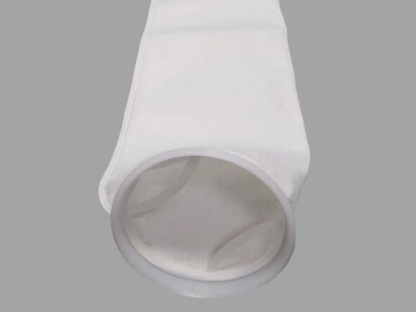 A piece of white color polyester filter bag on gray background.