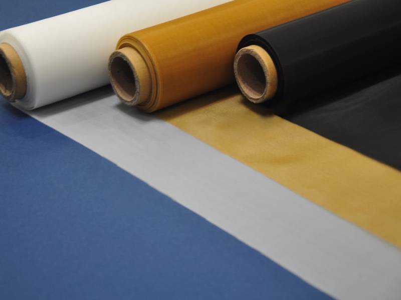 Three rolls of polyester filter mesh with white, yellow and black color.