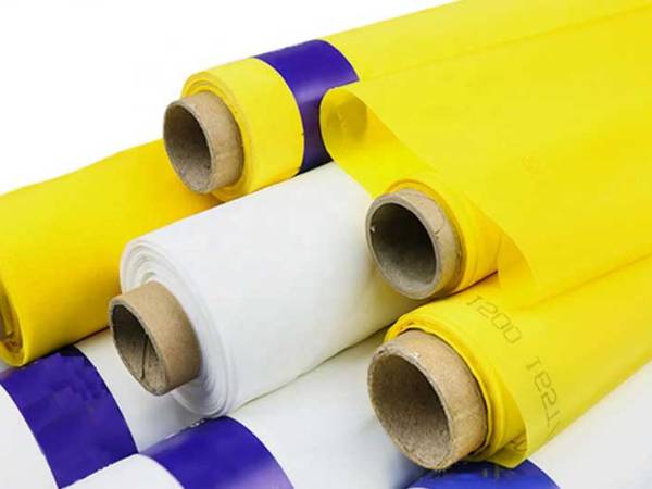 Several white and yellow polyester screen printing meshes on the white background.
